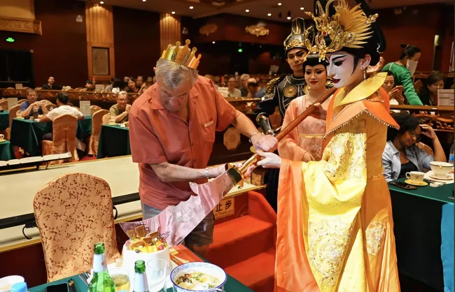 cutting cake with guan yus great sword | China Xian Tour: Private & Tailor-Made China Tours A performer and an audience cut cake with Guan Yu's Great Sword in Tang Dynasty Show in Xian