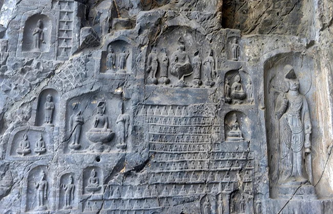 Mini Buddhist statues in Wanfo Cave in Luoyang Longmen Grottoes