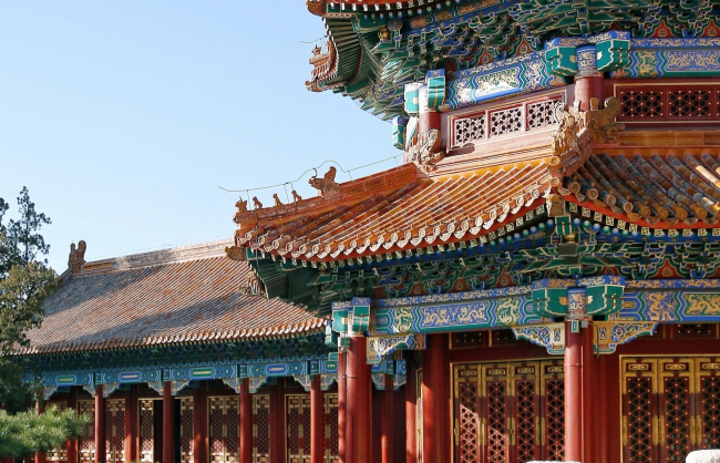 architecture-in-the-park | China Xian Tour: Private & Tailor-Made China Tours Colorful traditional Chinese temple with ornate multi-tiered roof, red columns, and decorative brackets under a clear sky.