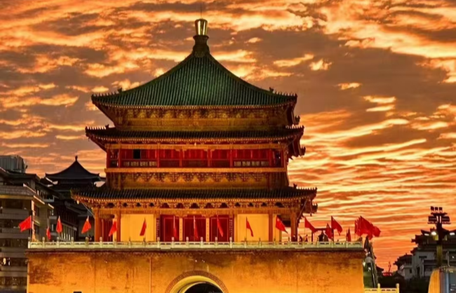 bell tower at sunset time | China Xian Tour: Private & Tailor-Made China Tours Xian Bell Tower bathed in the golden glow of a dramatic sunset sky