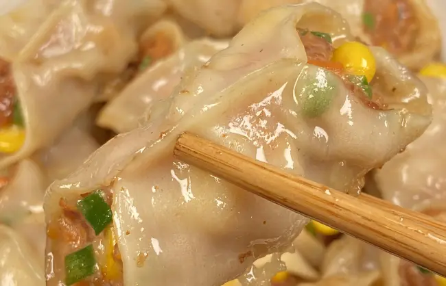 chinese-chopsticks-dumplings - China Xian Tour: Private & Tailor-Made China Tours Use Chinese chopsticks to eat dumplings