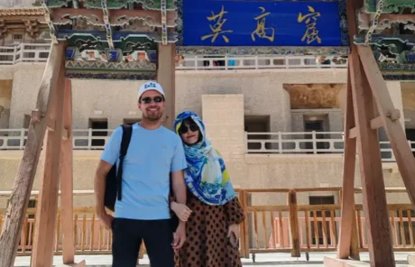 A Couple Visit Dunhuang Mogao Caves - China Xian Tour: Private & Tailor-Made China Tours A couple at the Mogao Grottoes of Dunhuang