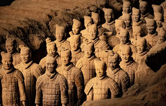 terra cotta warriors | China Xian Tour: Private & Tailor-Made China Tours Terracotta Army statues in an excavated pit, rows of life-size clay soldiers in armor.