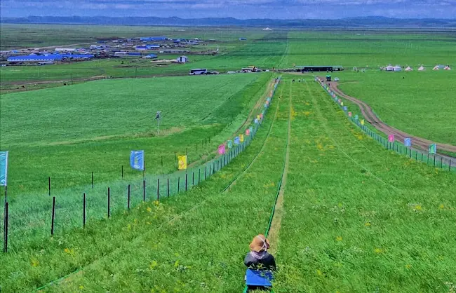 hulunbuir-grass-slide | China Xian Tour: Private & Tailor-Made China Tours Grass sliding on Hulunbuir grassland