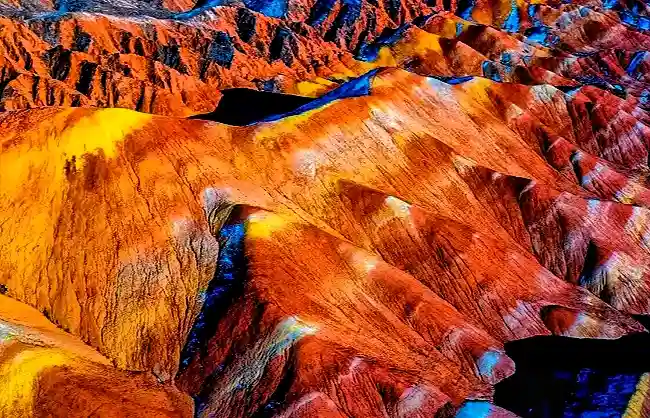 Surreal rainbow mountains, nature's fiery painted canvas